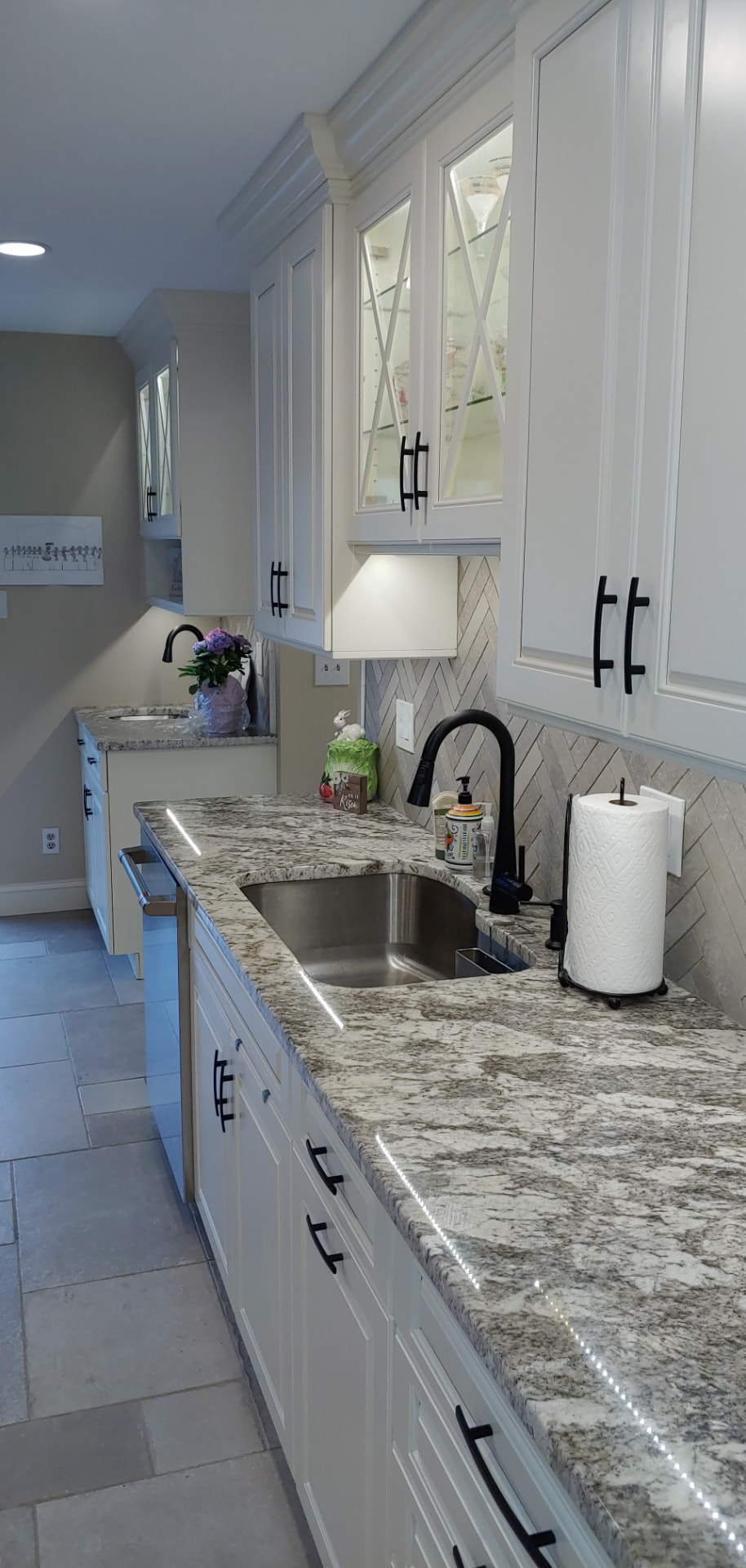 White shaker kitchen with herringbone backsplash, detail 2