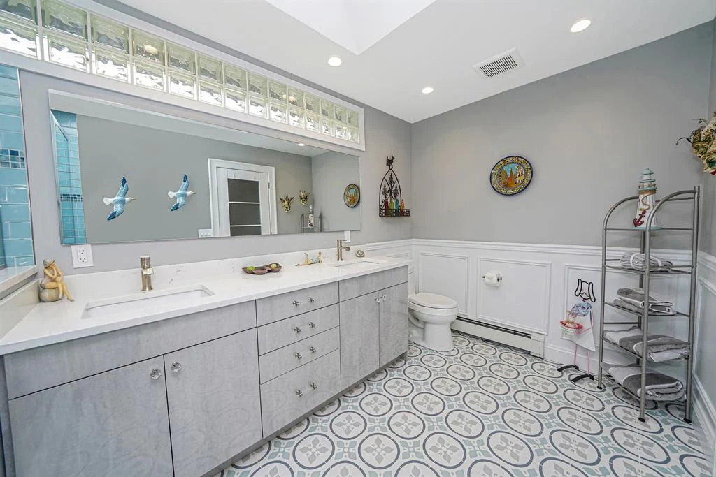 Open, light-filled kitchen by The Cabinet Coach