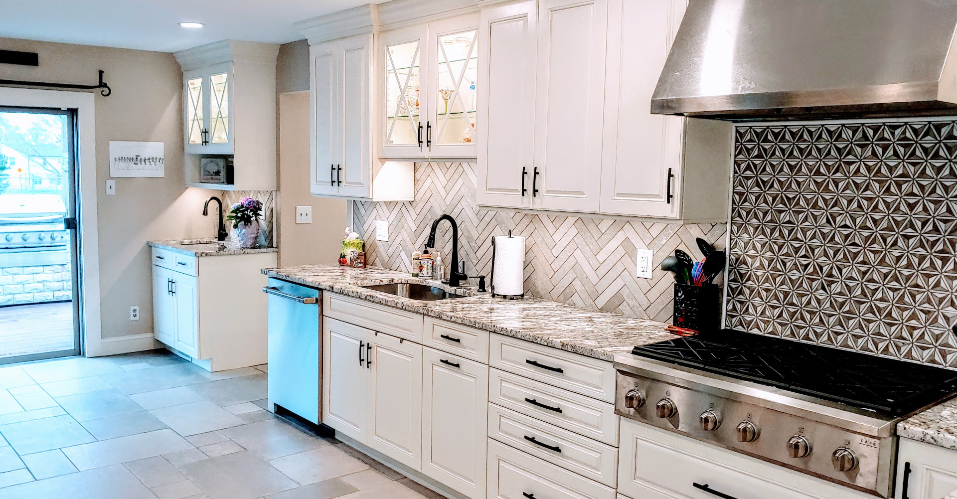 Kitchen project by The Cabinet Coach: White shaker kitchen with herringbone backsplash